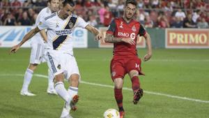 Zlatan Ibrahimovic (left) battles for the ball with Toronto FC midfielder Jay Chapman.(USA TODAY Sports) Zlatan Ibrahimovic (left) battles for the ball with Toronto FC midfielder Jay Chapman.(USA TODAY Sports)
