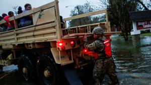 People being rescued by a member of the US Army during the passing of Hurricane Florence in the town of New Bern, North Carolina on September 14, 2018.(Reuters Photo) People being rescued by a member of the US Army during the passing of Hurricane Florence in the town of New Bern, North Carolina on September 14, 2018.(Reuters Photo)