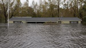 Rising flood waters approach the roof of a home in the aftermath of Hurricane Florence, in Leland, North Carolina, US, on September 16, 2018.(Reuters Photo) Rising flood waters approach the roof of a home in the aftermath of Hurricane Florence, in Leland, North Carolina, US, on September 16, 2018.(Reuters Photo)
