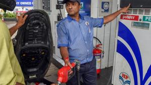 Mumbai: An employee shows the revised prices of petrol and diesel to a customer at a fuel station, as the fuel prices prices continued their record-breaking run, in Mumbai, Friday, September 7, 2018.(PTI) Mumbai: An employee shows the revised prices of petrol and diesel to a customer at a fuel station, as the fuel prices prices continued their record-breaking run, in Mumbai, Friday, September 7, 2018.(PTI)