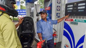 An employee shows the revised prices of petrol and diesel to a customer at a fuel station, as the fuel prices prices continued their record-breaking run, in Mumbai, Friday, September 7, 2018.(PTI File Photo) An employee shows the revised prices of petrol and diesel to a customer at a fuel station, as the fuel prices prices continued their record-breaking run, in Mumbai, Friday, September 7, 2018.(PTI File Photo)