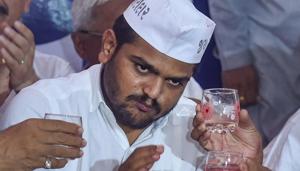 Ahmedabad: Patidar Anamat Andolan Samiti (PAAS) leader Hardik Patel being offered coconut water as he breaks his 19-day long indefinite hunger strike, in Ahmedabad on Wednesday.(PTI) Ahmedabad: Patidar Anamat Andolan Samiti (PAAS) leader Hardik Patel being offered coconut water as he breaks his 19-day long indefinite hunger strike, in Ahmedabad on Wednesday.(PTI)