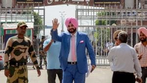 Punjab minister and former cricketer Navjot Singh Sidhu waves as he crosses the border to attend the swearing-in ceremony of Pakistan Prime Minister-elect Imran Khan, at Attari-Wagah border in Attari.(PTI File Photo)