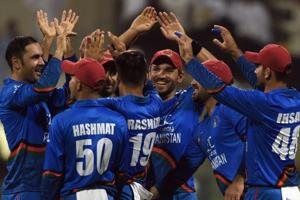 Mohammad Nabi (L) celebrates with teammates.(AFP) Mohammad Nabi (L) celebrates with teammates.(AFP)