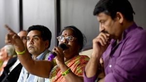 Kalawati Koli, mother of AAP worker Santosh Koli, speaks as MLA Kapil Mishra and BJP MP Manoj Tiwari look on, during a press conference at his residence in New Delhi on Tuesday.(Amal KS/HT PHOTO) Kalawati Koli, mother of AAP worker Santosh Koli, speaks as MLA Kapil Mishra and BJP MP Manoj Tiwari look on, during a press conference at his residence in New Delhi on Tuesday.(Amal KS/HT PHOTO)