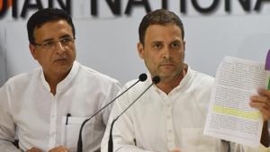 Congress president Rahul Gandhi with party spokesperson Rajdeep Surjewala shows a document during a press conference on demonetisation and Rafale Deal, at AICC headquarters in New Delhi.(Vipin Kumar/HT PHOTO) Congress president Rahul Gandhi with party spokesperson Rajdeep Surjewala shows a document during a press conference on demonetisation and Rafale Deal, at AICC headquarters in New Delhi.(Vipin Kumar/HT PHOTO)