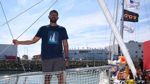 Abhilash Tomy on his boat ‘Thuriya’ in Les Sables d'Olonne Harbour, ahead of the solo around-the-world sailing race for the "Golden Globe Race" ocean race.(AFP File Photo) Abhilash Tomy on his boat ‘Thuriya’ in Les Sables d'Olonne Harbour, ahead of the solo around-the-world sailing race for the "Golden Globe Race" ocean race.(AFP File Photo)