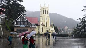 People take a stroll with umbrellas during rain at Ridge, Shimla on Saturday, September 22. 2018.(Deepak Sansta / Hindustan Times) People take a stroll with umbrellas during rain at Ridge, Shimla on Saturday, September 22. 2018.(Deepak Sansta / Hindustan Times)