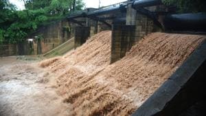 For the first time in a decade, two of Sukhna lake’s floodgates were opened by the administration after incessant rain in Chandigarh on Monday.(Sanjeev Sharma/HT) For the first time in a decade, two of Sukhna lake’s floodgates were opened by the administration after incessant rain in Chandigarh on Monday.(Sanjeev Sharma/HT)