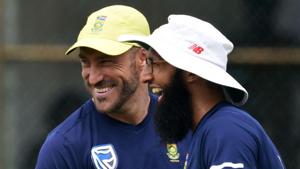 South African cricket team captain Faf du Plessis (L) shares a moment with a teammate Hashim Amla during a training session.(AFP) South African cricket team captain Faf du Plessis (L) shares a moment with a teammate Hashim Amla during a training session.(AFP)