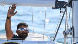 Abhilash Tomy gestures on his boat as he sets sails from Les Sables d'Olonne Harbour at the start of the solo around-the-world "Golden Globe Race" ocean race.(AFP File Photo) Abhilash Tomy gestures on his boat as he sets sails from Les Sables d'Olonne Harbour at the start of the solo around-the-world "Golden Globe Race" ocean race.(AFP File Photo)