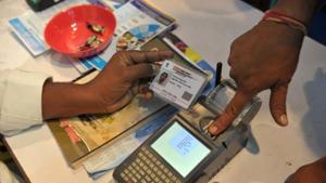 A visitor giving a thumb impression to withdraw money from his bank account with his Aadhaar card during a Digi Dhan Mela, held to promote digital payment, in Hyderabad.(AFP File Photo) A visitor giving a thumb impression to withdraw money from his bank account with his Aadhaar card during a Digi Dhan Mela, held to promote digital payment, in Hyderabad.(AFP File Photo)