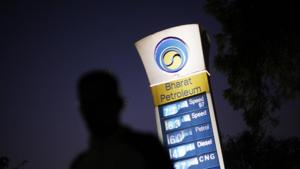 A Bharat Petroleum oil pump station displays the price of unleaded petrol and Diesel as a pedestrian walks past in New Delhi.(Reuters) A Bharat Petroleum oil pump station displays the price of unleaded petrol and Diesel as a pedestrian walks past in New Delhi.(Reuters)