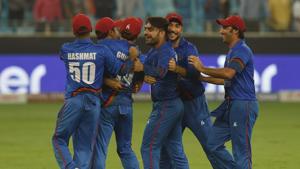 Afghan cricketers celebrate after the game against India ended in a tie on Tuesday.(AFP) Afghan cricketers celebrate after the game against India ended in a tie on Tuesday.(AFP)
