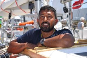 Abhilash Tomy poses on his boat "Thuriya" in Les Sables d'Olonne Harbour, ahead of the solo around-the-world sailing race.(AFP File Photo) Abhilash Tomy poses on his boat "Thuriya" in Les Sables d'Olonne Harbour, ahead of the solo around-the-world sailing race.(AFP File Photo)