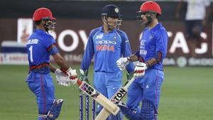 Afghanistan's Najibullah Zadran, left, walks to congratulate teammate Mohammad Nabi on scoring fifty runs during the one day international cricket match of Asia Cup between India and Afghanistan(AP) Afghanistan's Najibullah Zadran, left, walks to congratulate teammate Mohammad Nabi on scoring fifty runs during the one day international cricket match of Asia Cup between India and Afghanistan(AP)