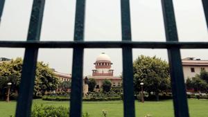 Supreme Court is pictured through a gate in New Delhi.(REUTERS) Supreme Court is pictured through a gate in New Delhi.(REUTERS)