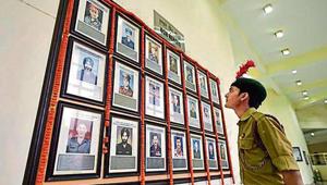 An NCC cadet looks at portraits of fallen soldiers during an event to celebrate the second anniversary of the surgical strike at Jawaharlal Nehru University on Saturday.(Burhaan Kinu/HT File Photo) An NCC cadet looks at portraits of fallen soldiers during an event to celebrate the second anniversary of the surgical strike at Jawaharlal Nehru University on Saturday.(Burhaan Kinu/HT File Photo)