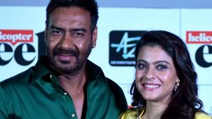 Kajol Devgn poses for a picture with her husband and actor Ajay Devgn as she celebrates her 43rd birthday during the trailer launch of their upcoming Hindi film Helicopter Eela.(AFP) Kajol Devgn poses for a picture with her husband and actor Ajay Devgn as she celebrates her 43rd birthday during the trailer launch of their upcoming Hindi film Helicopter Eela.(AFP)