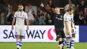 D.C. United forward Wayne Rooney (in black) celebrates after scoring a goal against Montreal Impact.(USA TODAY Sports) D.C. United forward Wayne Rooney (in black) celebrates after scoring a goal against Montreal Impact.(USA TODAY Sports)