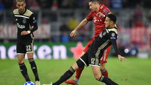 Bayern Munich's Polish forward Robert Lewandowski (right) vies for the ball with Ajax's Moroccan defender Noussair Mazraoui (centre) in Munich.(AFP) Bayern Munich's Polish forward Robert Lewandowski (right) vies for the ball with Ajax's Moroccan defender Noussair Mazraoui (centre) in Munich.(AFP)