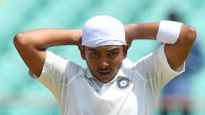 Indian cricketer Prithvi Shaw ties a bandana on his head during the first day of the first Test cricket match between India and West Indies at the Saurashtra Cricket Association stadium in Rajkot.(AFP) Indian cricketer Prithvi Shaw ties a bandana on his head during the first day of the first Test cricket match between India and West Indies at the Saurashtra Cricket Association stadium in Rajkot.(AFP)