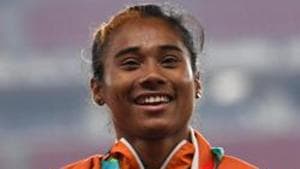 Silver medallist India's Hima Das celebrates during the victory ceremony for the women's 400m athletics event during the 2018 Asian Games in Jakarta.(AFP) Silver medallist India's Hima Das celebrates during the victory ceremony for the women's 400m athletics event during the 2018 Asian Games in Jakarta.(AFP)