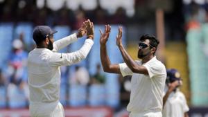 Indian cricketer Ravichandran Ashwin, right, celebrates after dismissing West indies' Kraigg Brathwaite during the third day of the first cricket test match between India and West Indies in Rajkot.(AP) Indian cricketer Ravichandran Ashwin, right, celebrates after dismissing West indies' Kraigg Brathwaite during the third day of the first cricket test match between India and West Indies in Rajkot.(AP)