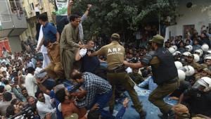 Supporters of Pakistan Muslim League Nawaz (PML-N) party stand on armoured vehicle carrying opposition leader Shahbaz Sharif on his arrival in the corruption court in Lahore on October 6, 2018.(AFP Photo) Supporters of Pakistan Muslim League Nawaz (PML-N) party stand on armoured vehicle carrying opposition leader Shahbaz Sharif on his arrival in the corruption court in Lahore on October 6, 2018.(AFP Photo)