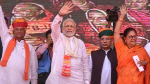 Prime Minister Narendra Modi with Rajasthan Chief Minister Vasundhara Raje and others wave at their supporters during 'Vijay Sankalp Sabha', in Ajmer, Saturday, Oct 6, 2018.(PTI)