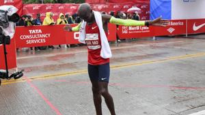 Mo Farah of Great Britain, raises his arms after he finishes in first place during the Bank of America Chicago Marathon.(AP) Mo Farah of Great Britain, raises his arms after he finishes in first place during the Bank of America Chicago Marathon.(AP)