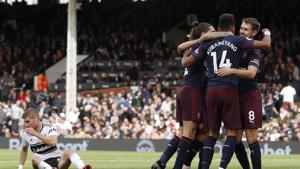 Arsenal's Gabonese striker Pierre-Emerick Aubameyang celebrates with teammates after scoring the team's fifth goal during the English Premier League football match between Fulham and Arsenal at Craven Cottage.(AFP) Arsenal's Gabonese striker Pierre-Emerick Aubameyang celebrates with teammates after scoring the team's fifth goal during the English Premier League football match between Fulham and Arsenal at Craven Cottage.(AFP)
