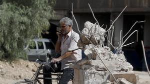 A man rides his bicycle at the Palestinian refugee camp of Yarmouk in the Syrian capital Damascus on October 6, 2018.(AP) A man rides his bicycle at the Palestinian refugee camp of Yarmouk in the Syrian capital Damascus on October 6, 2018.(AP)