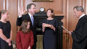 Judge Brett Kavanaugh is sworn in as an Associate Justice of the US Supreme Court by Chief Justice John Roberts as Kavanaugh's wife Ashley holds the family bible and his daughters Liza and Margaret in Washington, US, October 6, 2018.(Fred Schilling/US Supreme Court/Handout) Judge Brett Kavanaugh is sworn in as an Associate Justice of the US Supreme Court by Chief Justice John Roberts as Kavanaugh's wife Ashley holds the family bible and his daughters Liza and Margaret in Washington, US, October 6, 2018.(Fred Schilling/US Supreme Court/Handout)