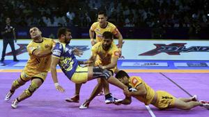 Chennai: Telugu Titans (Yellow) players in action against Tamil Thalaivas during their Pro Kabaddi league season 6 match, at Jawaharlal Nehru Indoor Stadium, in Chennai.(AP) Chennai: Telugu Titans (Yellow) players in action against Tamil Thalaivas during their Pro Kabaddi league season 6 match, at Jawaharlal Nehru Indoor Stadium, in Chennai.(AP)