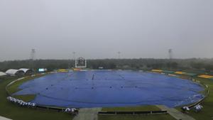 The ground lies covered as it rains during the first one-day international cricket match between England and Sri Lanka in Dambulla.(AP) The ground lies covered as it rains during the first one-day international cricket match between England and Sri Lanka in Dambulla.(AP)