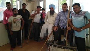 Balwinder and his 11 differentially abled co-workers, most of them unable to use their arms or legs, submitted their second application for their salaries to senior superintendent of police traffic Shashank Anand on September 17.(HT Photo) Balwinder and his 11 differentially abled co-workers, most of them unable to use their arms or legs, submitted their second application for their salaries to senior superintendent of police traffic Shashank Anand on September 17.(HT Photo)