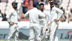 Indian cricketer Kuldeep Yadav (C) celebrates with captain Virat Kohli (R) after the dismissal of West Indies cricketer Shimron Hetmyer during the first day's play of the second Test cricket match between India and West Indies at the Rajiv Gandhi International Cricket Stadium.(AFP) Indian cricketer Kuldeep Yadav (C) celebrates with captain Virat Kohli (R) after the dismissal of West Indies cricketer Shimron Hetmyer during the first day's play of the second Test cricket match between India and West Indies at the Rajiv Gandhi International Cricket Stadium.(AFP)
