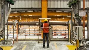 A worker stands inside a paint factory in Gwalior, Madhya Pradesh.(Bloomberg) A worker stands inside a paint factory in Gwalior, Madhya Pradesh.(Bloomberg)