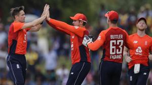 England's Chris Woakes, left, celebrates the dismissal of Sri Lanka's Dinesh Chandimal with his team mates during their second one-day international cricket match in Dambulla, Sri Lanka, Saturday, Oct. 13, 2018. (AP Photo/Eranga Jayawardena)(AP) England's Chris Woakes, left, celebrates the dismissal of Sri Lanka's Dinesh Chandimal with his team mates during their second one-day international cricket match in Dambulla, Sri Lanka, Saturday, Oct. 13, 2018. (AP Photo/Eranga Jayawardena)(AP)
