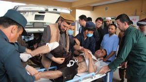 Afghan volunteers transport an injured man on a stretcher to a hospital following a bomb attack in Taloqan in northeastern Takhar province on October 13, 2018.(AFP Photo) Afghan volunteers transport an injured man on a stretcher to a hospital following a bomb attack in Taloqan in northeastern Takhar province on October 13, 2018.(AFP Photo)