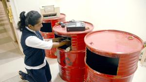 A school student puts e-waste in a drum to be reused on International E-Waste Day at Sadhu Vaswani International School Sanpada in Navi Mumbai.(HT Photo) A school student puts e-waste in a drum to be reused on International E-Waste Day at Sadhu Vaswani International School Sanpada in Navi Mumbai.(HT Photo)