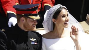 Britain's Prince Harry and Meghan Markle wave as they leave Windsor Castle in a carriage after their wedding ceremony at St. George's Chapel in Windsor Castle in Windsor, near London, England.(AP File) Britain's Prince Harry and Meghan Markle wave as they leave Windsor Castle in a carriage after their wedding ceremony at St. George's Chapel in Windsor Castle in Windsor, near London, England.(AP File)