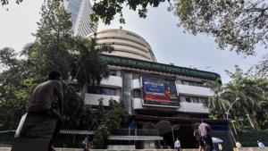 People watch share prices on a digital broadcast outside the Bombay Stock Exchange (BSE) in Mumbai on October 11.(Kunal Patil/HT Photo) People watch share prices on a digital broadcast outside the Bombay Stock Exchange (BSE) in Mumbai on October 11.(Kunal Patil/HT Photo)