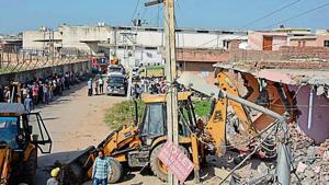 Demolition drives have been carried out in villages after the high court banned construction within 100 metres of the airport.(HT File) Demolition drives have been carried out in villages after the high court banned construction within 100 metres of the airport.(HT File)
