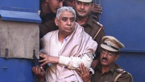 Self-styled godman Rampal being brought to court in Chandigarh in 2014. Rampal was arrested that year 2014 following a days-long standoff between the police and his supporters in which six people died and hundreds were injured.(AP) Self-styled godman Rampal being brought to court in Chandigarh in 2014. Rampal was arrested that year 2014 following a days-long standoff between the police and his supporters in which six people died and hundreds were injured.(AP)