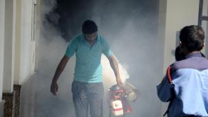 File photo of a health worker fumigating a building in Gurugram. Dengue season usually starts in June and lasts until mid-December(HT File Photo) File photo of a health worker fumigating a building in Gurugram. Dengue season usually starts in June and lasts until mid-December(HT File Photo)