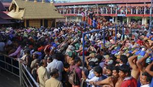 Worshippers stand in queues outside the Sabarimala temple. Protests erupted in many places in Kerala on Friday over the disruption of pooja in Sabarimala earlier in the day shortly before two women were forced to return from the vicinity of the temple.(AP File Photo) Worshippers stand in queues outside the Sabarimala temple. Protests erupted in many places in Kerala on Friday over the disruption of pooja in Sabarimala earlier in the day shortly before two women were forced to return from the vicinity of the temple.(AP File Photo)