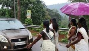 Devotees stop a car to check if any women are headed towards the Sabarimala temple, Kerala, October 16(REUTERS) Devotees stop a car to check if any women are headed towards the Sabarimala temple, Kerala, October 16(REUTERS)