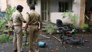 Police officers stand outside the ransacked house of Rehana Fathima, who made an attempt to enter Sabarimala temple which traditionally bars the entry of women of menstrual age, in Kochi, on October 19, 2018.(Reuters) Police officers stand outside the ransacked house of Rehana Fathima, who made an attempt to enter Sabarimala temple which traditionally bars the entry of women of menstrual age, in Kochi, on October 19, 2018.(Reuters)